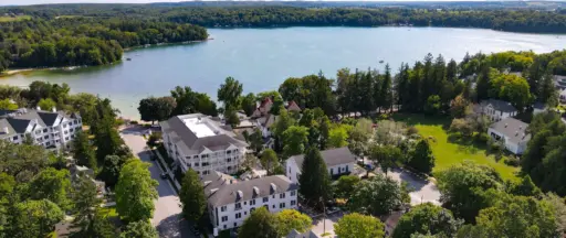 view of buildings, lake, and sky