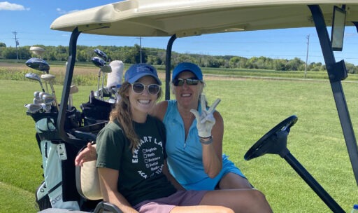 ladies on golf cart