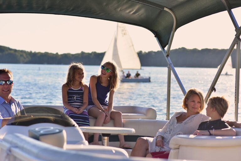 family on a boat on a lake