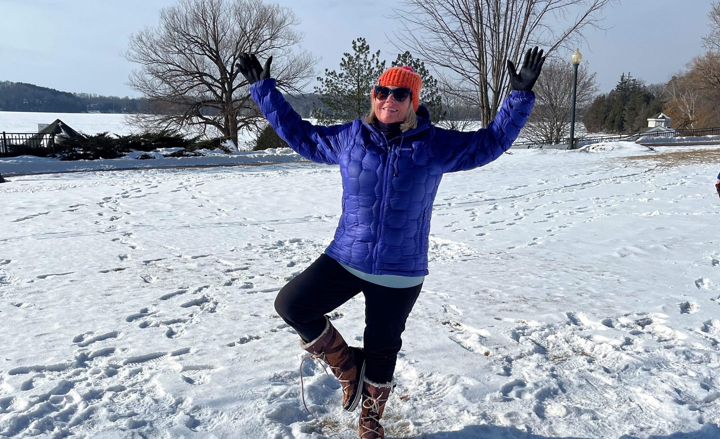 woman doing a yoga pose in the snow